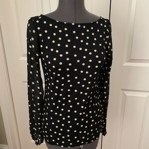 Scoop neck jersey top with semi sheer sleeves.